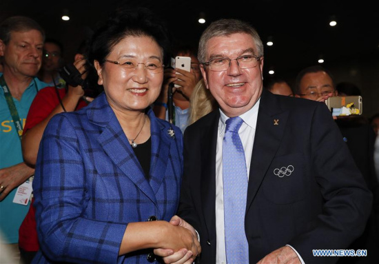 Chinese vice premier Liu Yandong (L) shakes hands with International Olympic Committee President Thomas Bach in Rio de Janeiro, Brazil, Aug. 6, 2016. (Xinhua/Han Yan) Chinese vice premier Liu Yandong (L) shakes hands with International Olympic Committee President Thomas Bach in Rio de Janeiro, Brazil, Aug. 6, 2016. (Xinhua/Han Yan)