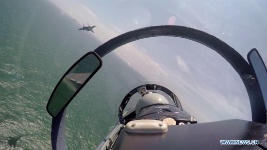 A Chinese fighter plane partols over the South China Sea. Chinese Air Force aircraft, including H-6K bombers and Su-30 fighters, have completed a patrol of airspace above the Nansha and Huangyan islands in the South China Sea, said a spokesperson Saturday. (Xinhua/Fan Yishu) A Chinese fighter plane partols over the South China Sea. Chinese Air Force aircraft, including H-6K bombers and Su-30 fighters, have completed a patrol of airspace above the Nansha and Huangyan islands in the South China Sea, said a spokesperson Saturday. (Xinhua/Fan Yishu)