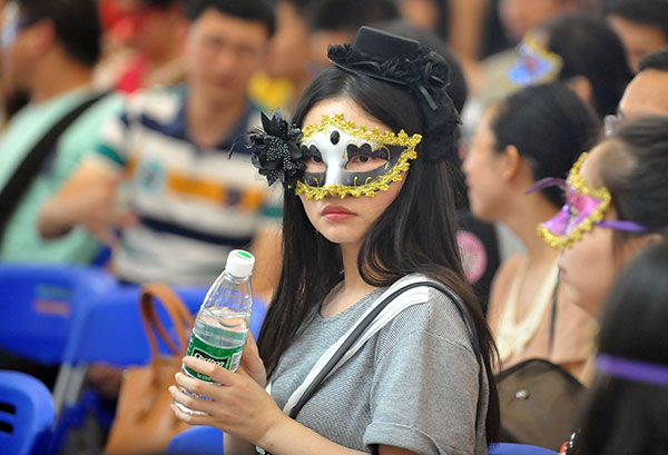 A masked girl participates in a joint dating party in Wuhan, Hubei province, on Saturday, celebrating the upcoming Qixi Festival. MIAO JIAN/CHINA DAILY A masked girl participates in a joint dating party in Wuhan, Hubei province, on Saturday, celebrating the upcoming Qixi Festival. MIAO JIAN/CHINA DAILY