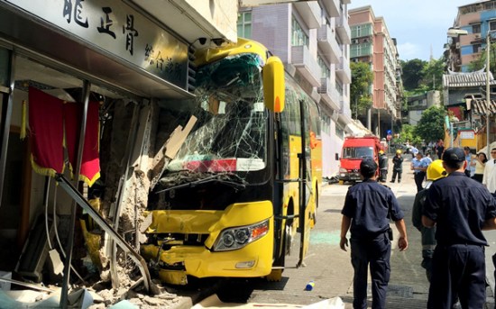 A bus and a storefront are heavily damaged after the vehicle rolled downhill on Monday in Macao. (Photo/Xinhua) A bus and a storefront are heavily damaged after the vehicle rolled downhill on Monday in Macao. (Photo/Xinhua)