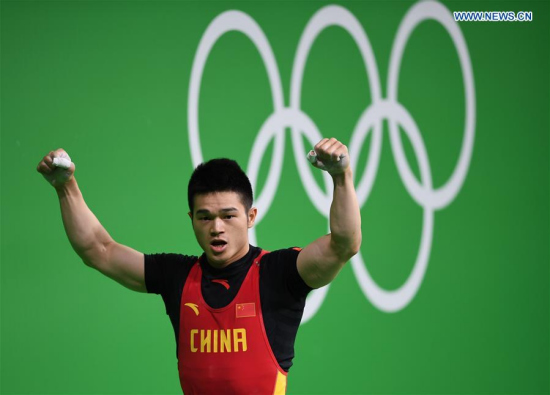 China's Shi Zhiyong celebrates during the men's 69kg final of weightlifting at the 2016 Rio Olympic Games in Rio de Janeiro, Brazil, on Aug. 9, 2016. Shi Zhiyong won the gold medal. (Xinhua/Cheng Min) China's Shi Zhiyong celebrates during the men's 69kg final of weightlifting at the 2016 Rio Olympic Games in Rio de Janeiro, Brazil, on Aug. 9, 2016. Shi Zhiyong won the gold medal. (Xinhua/Cheng Min)