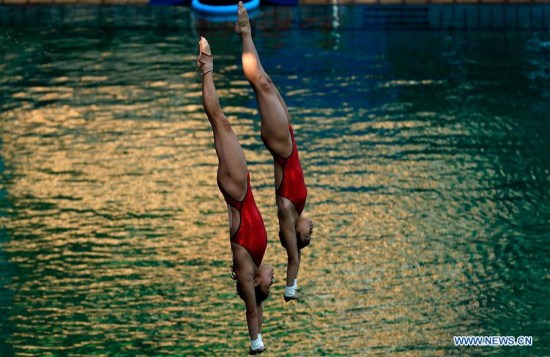 Chen Ruolin and Liu Huixia of China compete during the final of women's synchronised 10m platform of diving at the 2016 Rio Olympic Games in Rio de Janeiro, Brazil, on Aug. 9, 2016. Chen Ruolin and Liu Huixia won gold medal with scores of 354. (Xinhua/Cao Can) Chen Ruolin and Liu Huixia of China compete during the final of women's synchronised 10m platform of diving at the 2016 Rio Olympic Games in Rio de Janeiro, Brazil, on Aug. 9, 2016. Chen Ruolin and Liu Huixia won gold medal with scores of 354. (Xinhua/Cao Can)