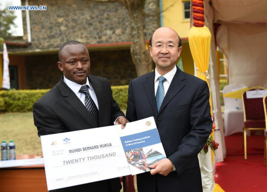 Chinese ambassador to Kenya Liu Xianfa (R) presents an award to an excellent student during the graduation ceremony of the railway technology course at Railway Training Institute in Nairobi, capital of Kenya, Aug. 8, 2016. (Xinhua/Li Baishun) Chinese ambassador to Kenya Liu Xianfa (R) presents an award to an excellent student during the graduation ceremony of the railway technology course at Railway Training Institute in Nairobi, capital of Kenya, Aug. 8, 2016. (Xinhua/Li Baishun)