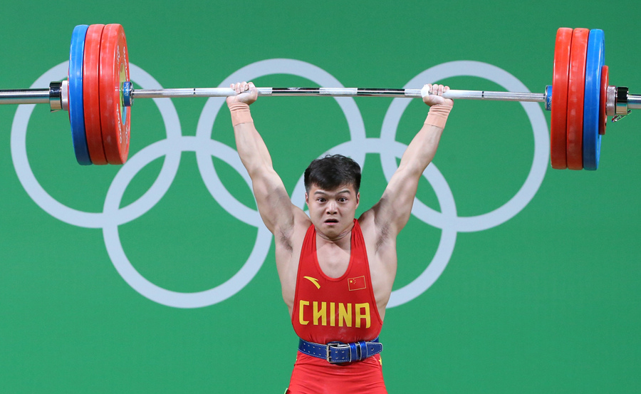 Long Qingquan of China wins the men's 56kg category of the Rio 2016 Olympic Games weightlifting events at the Riocentro in Rio de Janeiro, Brazil, August 7, 2016.(Photo/Xinhua) Long Qingquan of China wins the men's 56kg category of the Rio 2016 Olympic Games weightlifting events at the Riocentro in Rio de Janeiro, Brazil, August 7, 2016.(Photo/Xinhua)