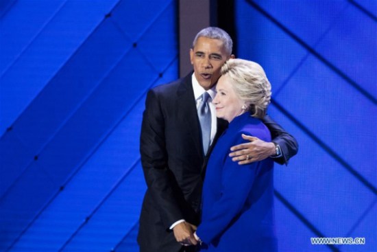 U.S. President Barack Obama (L) hugs U.S. Democratic Presidential Candidate Hillary Clinton on the third day of the 2016 U.S. Democratic National Convention, at Wells Fargo Center in Philadelphia, Pennsylvania, the United States, on July 27, 2016. (Photo: Xinhua/Li Muzi) U.S. President Barack Obama (L) hugs U.S. Democratic Presidential Candidate Hillary Clinton on the third day of the 2016 U.S. Democratic National Convention, at Wells Fargo Center in Philadelphia, Pennsylvania, the United States, on July 27, 2016. (Photo: Xinhua/Li Muzi)