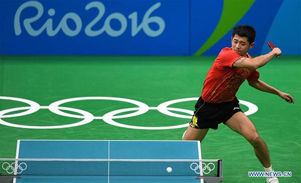 China's Zhang Jike returns the ball against Vladimir Samsonov of Belarus during men's singles semifinal of table tennis at the 2016 Rio Olympic Games in Rio de Janeiro, Brazil, on Aug. 11, 2016. Zhang Jike won 4-1.(Photo/Xinhua) China's Zhang Jike returns the ball against Vladimir Samsonov of Belarus during men's singles semifinal of table tennis at the 2016 Rio Olympic Games in Rio de Janeiro, Brazil, on Aug. 11, 2016. Zhang Jike won 4-1.(Photo/Xinhua)