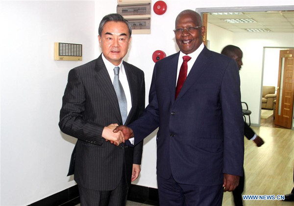 Chinese Foreign Minister Wang Yi (L) shakes hands with his Ugandan counterpart Sam Kutesa during their talks in Kampala, Uganda, Aug. 11, 2016. (Xinhua/Yuan Qing) Chinese Foreign Minister Wang Yi (L) shakes hands with his Ugandan counterpart Sam Kutesa during their talks in Kampala, Uganda, Aug. 11, 2016. (Xinhua/Yuan Qing)