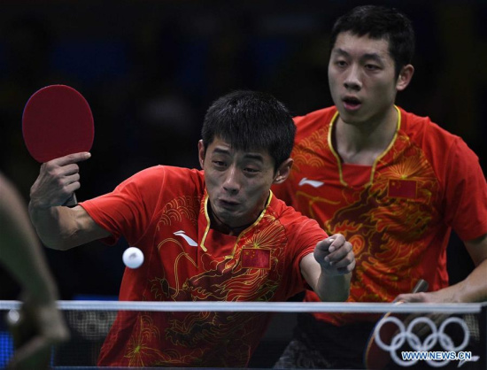 China's Zhang Jike (L) and Xu Xin compete during men's team quarterfinal of Table Tennis against Britain at the 2016 Rio Olympic Games in Rio de Janeiro, Brazil, on Aug. 14, 2016. China won 3-0. (Xinhua/Wang Peng) China's Zhang Jike (L) and Xu Xin compete during men's team quarterfinal of Table Tennis against Britain at the 2016 Rio Olympic Games in Rio de Janeiro, Brazil, on Aug. 14, 2016. China won 3-0. (Xinhua/Wang Peng)