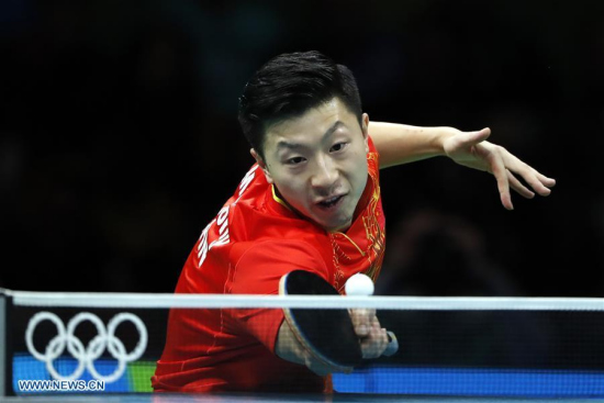 China's Ma Long competes during the men's singles table tennis final against Zhang Jike of China at the 2016 Rio Olympic Games in Rio de Janeiro, Brazil, on Aug. 11, 2016. Ma Long won the gold medal. (Xinhua/Shen Bohan) China's Ma Long competes during the men's singles table tennis final against Zhang Jike of China at the 2016 Rio Olympic Games in Rio de Janeiro, Brazil, on Aug. 11, 2016. Ma Long won the gold medal. (Xinhua/Shen Bohan)