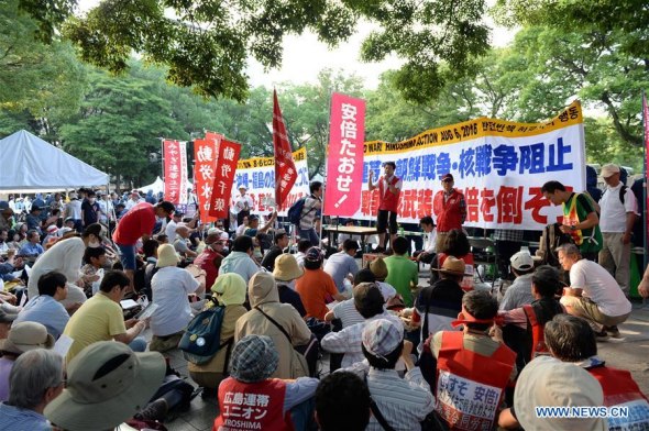 People attend a protest near the Peace Momorial Park in Hiroshima, Japan, on Aug. 6, 2016. (Xinhua/Ma Ping) People attend a protest near the Peace Momorial Park in Hiroshima, Japan, on Aug. 6, 2016. (Xinhua/Ma Ping)
