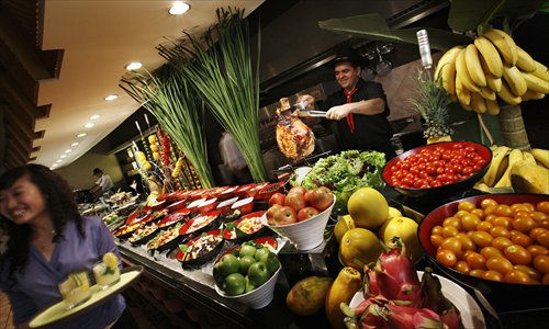 A cook prepares the buffet at Brazilian Churrascos. (Photo: Courtesy of Pei Pei) A cook prepares the buffet at Brazilian Churrascos. (Photo: Courtesy of Pei Pei)