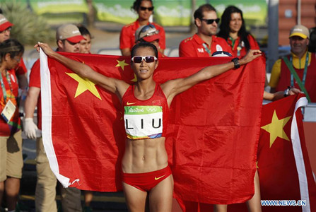 China's Liu Hong celebrates after the women's 20KM race walk at the 2016 Rio Olympic Games in Rio de Janeiro, Brazil, on Aug. 19, 2016. Liu Hong won the gold medal. (Xinhua/Wang Lili) China's Liu Hong celebrates after the women's 20KM race walk at the 2016 Rio Olympic Games in Rio de Janeiro, Brazil, on Aug. 19, 2016. Liu Hong won the gold medal. (Xinhua/Wang Lili)