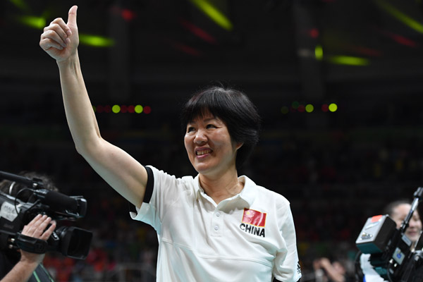 Chinese head coach Lang Ping celebrates after winning the gold medal in women's volleyball after beating Serbia 3:1 in Rio de Janeiro on Aug 20, 2016. (Photo/Xinhua) Chinese head coach Lang Ping celebrates after winning the gold medal in women's volleyball after beating Serbia 3:1 in Rio de Janeiro on Aug 20, 2016. (Photo/Xinhua)