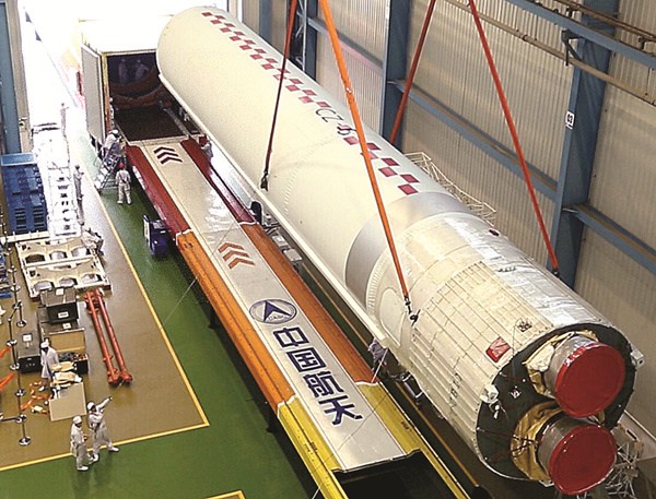 The Long March 5 carrier rocket is loaded onto a cargo truck at an unspecified assembly plant. (Photo/Xinhua) The Long March 5 carrier rocket is loaded onto a cargo truck at an unspecified assembly plant. (Photo/Xinhua)