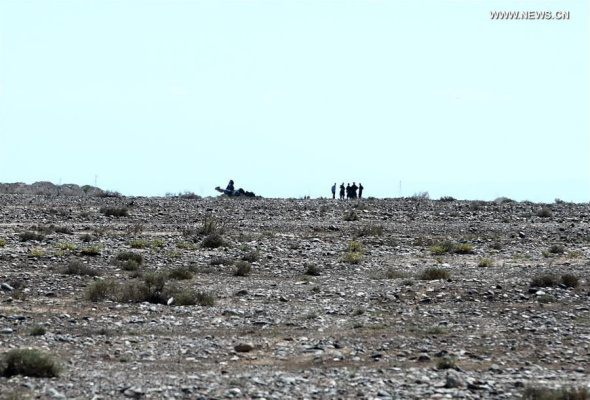 Photo taken on Aug. 27, 2016 shows the accident site after an acrobatic plane plummeted to the ground during the 1st Silk Road International General Aviation Convention in Zhangye, northwest China's Gansu Province. The pilot of the acrobatic plane was killed. (Xinhua/Fan Peishen)