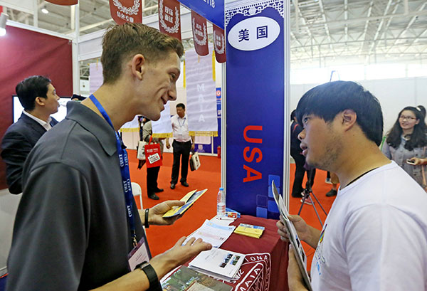 A university official from the US introduces his school during an international education expo in Beijing in May. (Photo/China Daily) A university official from the US introduces his school during an international education expo in Beijing in May. (Photo/China Daily)
