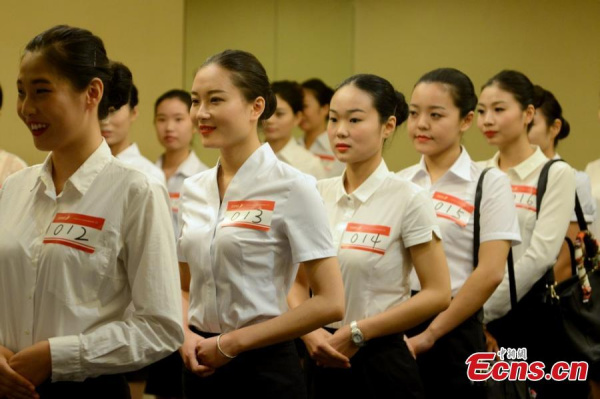 Applicants for the job as flight attendant wait to be interviewed by an airlines company in Suzhou, Jiangsu province, Oct 10, 2014. (Photo/Wang Sizhe) Applicants for the job as flight attendant wait to be interviewed by an airlines company in Suzhou, Jiangsu province, Oct 10, 2014. (Photo/Wang Sizhe)