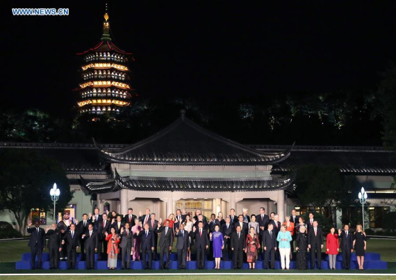 Chinese President Xi Jinping and his wife Peng Liyuan pose for a group photo with heads of foreign delegations and their spouses before a banquet for the Group of 20 (G20) summit in Hangzhou, capital of east China's Zhejiang Province, Sept. 4, 2016. (Photo: Xinhua/Yao Dawei) Chinese President Xi Jinping and his wife Peng Liyuan pose for a group photo with heads of foreign delegations and their spouses before a banquet for the Group of 20 (G20) summit in Hangzhou, capital of east China's Zhejiang Province, Sept. 4, 2016. (Photo: Xinhua/Yao Dawei)
