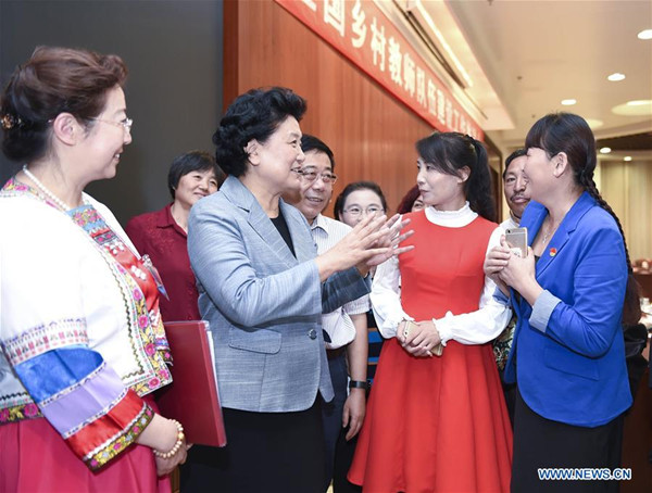 Chinese Vice Premier Liu Yandong talks to teachers working in rural areas after a promotion meeting in Beijing, capital of China, Sept. 7, 2016. Liu has called for more efforts to support rural teachers and improve the rural education, before national Teachers' Day on Sept. 10. (Xinhua/Zhang Ling) Chinese Vice Premier Liu Yandong talks to teachers working in rural areas after a promotion meeting in Beijing, capital of China, Sept. 7, 2016. Liu has called for more efforts to support rural teachers and improve the rural education, before national Teachers' Day on Sept. 10. (Xinhua/Zhang Ling)