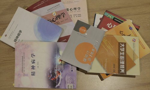 College textbooks that Qiu Bai says discriminate against gay people. (Photo/Courtesy of Qiu Bai) College textbooks that Qiu Bai says discriminate against gay people. (Photo/Courtesy of Qiu Bai)