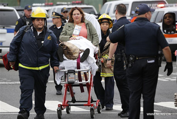 A victim is wheeled on a stretcher out of the Hoboken station following a train crash in New Jersey, the United States on Sept. 29, 2016. One person was confirmed killed and 108 others injured after a transit train crashed into New Jersey's Hoboken station during the morning rush hour Thursday. (Xinhua/Gary Hershorn) A victim is wheeled on a stretcher out of the Hoboken station following a train crash in New Jersey, the United States on Sept. 29, 2016. One person was confirmed killed and 108 others injured after a transit train crashed into New Jersey's Hoboken station during the morning rush hour Thursday. (Xinhua/Gary Hershorn)