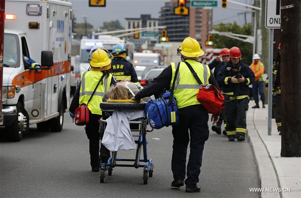 A victim is wheeled on a stretcher out of the Hoboken station following a train crash in New Jersey, the United States on Sept. 29, 2016. One person was confirmed killed and 108 others injured after a transit train crashed into New Jersey's Hoboken station during the morning rush hour Thursday. (Xinhua/Gary Hershorn) A victim is wheeled on a stretcher out of the Hoboken station following a train crash in New Jersey, the United States on Sept. 29, 2016. One person was confirmed killed and 108 others injured after a transit train crashed into New Jersey's Hoboken station during the morning rush hour Thursday. (Xinhua/Gary Hershorn)