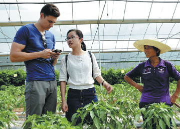 Adam Hegarty, during an interview at a vegetable greenhouse in Xingguo county, Jiangxi province. Liu Zhiqiang / For China Daily Adam Hegarty, during an interview at a vegetable greenhouse in Xingguo county, Jiangxi province. Liu Zhiqiang / For China Daily