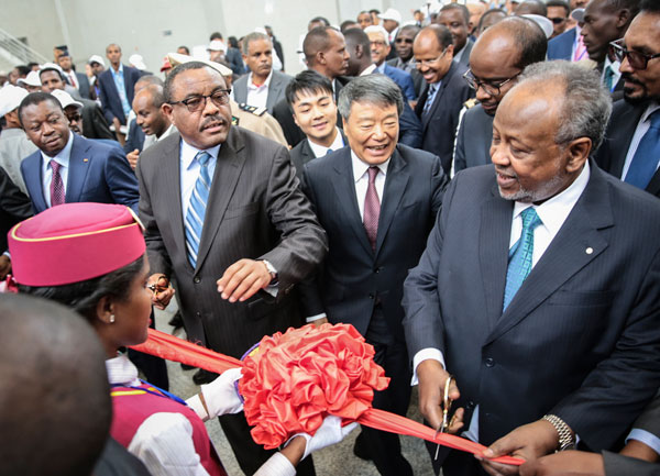 Xu Shaoshi (center), head of the National Development and Reform Commission and special envoy representing President Xi Jinping, watches as Hailemariam Desalegn, Ethiopia's prime minister (left), and Djibouti's President Ismail Omar Guelleh (right) cut the ribbon to launch the new railway from Addis Ababa, Ethiopia, to the port of Djibouti on Wednesday in Addis Ababa. QIN BIN / FOR CHINA DAILY Xu Shaoshi (center), head of the National Development and Reform Commission and special envoy representing President Xi Jinping, watches as Hailemariam Desalegn, Ethiopia's prime minister (left), and Djibouti's President Ismail Omar Guelleh (right) cut the ribbon to launch the new railway from Addis Ababa, Ethiopia, to the port of Djibouti on Wednesday in Addis Ababa. QIN BIN / FOR CHINA DAILY