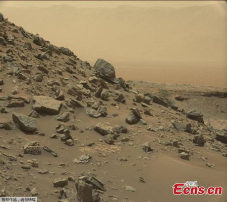 This image take by NASA's Curiosity Mars Rover shows a dramatic hillside outcrop with sandstone layers. (Photo/NASA) This image take by NASA's Curiosity Mars Rover shows a dramatic hillside outcrop with sandstone layers. (Photo/NASA)