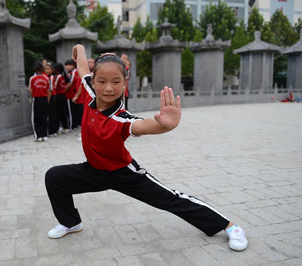 Children learn kung fu in a school of the Taguo Education Group in Dengfeng, Henan. (Photo by Xiang Mingchao/China Daily) Children learn kung fu in a school of the Taguo Education Group in Dengfeng, Henan. (Photo by Xiang Mingchao/China Daily)
