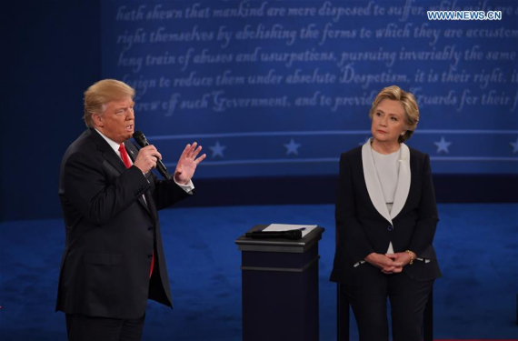 Republican presidential candidate Donald Trump (L) and Democratic presidential candidate Hillary Clinton participate in the second presidential debate at Washington University in St. Louis, the United States, on Oct. 9, 2016. (Photo: Xinhua/Yin Bogu) Republican presidential candidate Donald Trump (L) and Democratic presidential candidate Hillary Clinton participate in the second presidential debate at Washington University in St. Louis, the United States, on Oct. 9, 2016. (Photo: Xinhua/Yin Bogu)