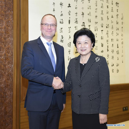 Chinese Vice Premier Liu Yandong(R) shakes hands with Tibor Navracsics, the chair of China-EU high-level people-to-people dialogue from the EU side, and EU Commissioner for Education, Culture, Youth and Sport, in Beijing, capital of China, Oct. 10, 2016. (Photo: Xinhua/Zhang Ling) Chinese Vice Premier Liu Yandong(R) shakes hands with Tibor Navracsics, the chair of China-EU high-level people-to-people dialogue from the EU side, and EU Commissioner for Education, Culture, Youth and Sport, in Beijing, capital of China, Oct. 10, 2016. (Photo: Xinhua/Zhang Ling)