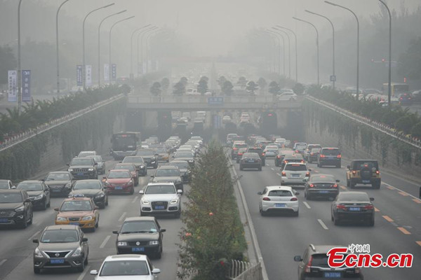 Heavy smog and fog hit Beijing, Oct. 14, 2014. Beijing issued a yellow alert for smog amid air pollution and fog that reduced visibility to about one kilometer. China has a four-tier color-coded weather warning system, with red representing the most severe weather, followed by orange, yellow and blue. (Photo: China News Service/Jin Shuo) Heavy smog and fog hit Beijing, Oct. 14, 2014. Beijing issued a yellow alert for smog amid air pollution and fog that reduced visibility to about one kilometer. China has a four-tier color-coded weather warning system, with red representing the most severe weather, followed by orange, yellow and blue. (Photo: China News Service/Jin Shuo)