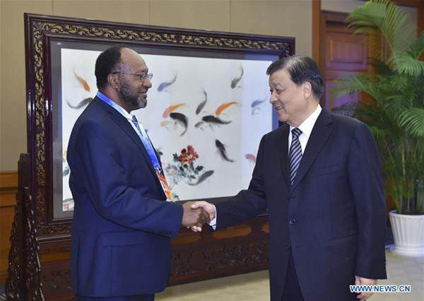 Liu Yunshan (R), a member of the Standing Committee of the Political Bureau of the Communist Party of China (CPC) Central Committee, meets with Charlot Salwai, president of the Reunification Movement for Change (RMC) and prime minister of Vanuatu, who attends The CPC in Dialogue with the World 2016 conference, in southwest China's Chongqing Municipality, Oct. 14, 2016. (Xinhua/Gao Jie) Liu Yunshan (R), a member of the Standing Committee of the Political Bureau of the Communist Party of China (CPC) Central Committee, meets with Charlot Salwai, president of the Reunification Movement for Change (RMC) and prime minister of Vanuatu, who attends The CPC in Dialogue with the World 2016 conference, in southwest China's Chongqing Municipality, Oct. 14, 2016. (Xinhua/Gao Jie)