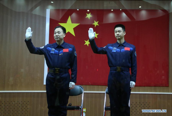 Chinese astronauts Jing Haipeng (L) and Chen Dong meet the media at a press conference at the Jiuquan Satellite Launch Center in northwest China, Oct. 16, 2016. The two male astronauts will carry out the Shenzhou-11 mission. The Shenzhou-11 manned spacecraft will be launched at 7:30 a.m. Oct. 17, 2016 Beijing Time (2330 GMT Oct. 16). (Photo: Xinhua/Li Gang) Chinese astronauts Jing Haipeng (L) and Chen Dong meet the media at a press conference at the Jiuquan Satellite Launch Center in northwest China, Oct. 16, 2016. The two male astronauts will carry out the Shenzhou-11 mission. The Shenzhou-11 manned spacecraft will be launched at 7:30 a.m. Oct. 17, 2016 Beijing Time (2330 GMT Oct. 16). (Photo: Xinhua/Li Gang)