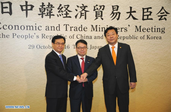 (L-R) Chinese Commerce Minister Gao Hucheng, Japanese Minister of Economy, Trade and Industry Hiroshige Seko and South Korean Trade, Industry and Energy Minister Joo Hyung Hwan pose for a photo before the 11th Economic and Trade Ministers' Meeting among China-Japan-South Korea in Tokyo, Japan, Oct. 29, 2016. Trade ministers from China, Japan and South Korea agreed on Saturday to strengthen trade and economic cooperation between the three neighbors. (Xinhua/Hua Yi) (L-R) Chinese Commerce Minister Gao Hucheng, Japanese Minister of Economy, Trade and Industry Hiroshige Seko and South Korean Trade, Industry and Energy Minister Joo Hyung Hwan pose for a photo before the 11th Economic and Trade Ministers' Meeting among China-Japan-South Korea in Tokyo, Japan, Oct. 29, 2016. Trade ministers from China, Japan and South Korea agreed on Saturday to strengthen trade and economic cooperation between the three neighbors. (Xinhua/Hua Yi)