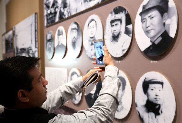 Akhil Parashar from India views the Long March exhibition in Beijing on Monday. (Photo by WANG ZHUANGFEI/CHINA DAILY) Akhil Parashar from India views the Long March exhibition in Beijing on Monday. (Photo by WANG ZHUANGFEI/CHINA DAILY)
