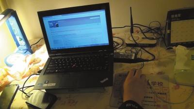 A laptop of a 19-year-old college student surnamed Sun who is involved in spreading child porn videos is found at the suspect's home. (Photo/Beijing News) A laptop of a 19-year-old college student surnamed Sun who is involved in spreading child porn videos is found at the suspect's home. (Photo/Beijing News)