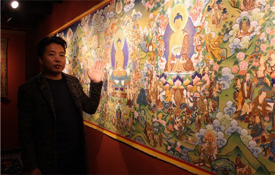Kelsang Dawa shows his thangka collection at his painting center in Shangri-La, Yunnan province. The Tibetan art genre is energy-intensive-sometimes it takes years to finish one piece. (WANG KAIHAO/CHINA DAILY) Kelsang Dawa shows his thangka collection at his painting center in Shangri-La, Yunnan province. The Tibetan art genre is energy-intensive-sometimes it takes years to finish one piece. (WANG KAIHAO/CHINA DAILY)