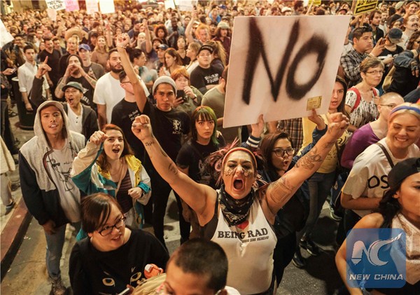 Demonstrators gather to protest a day after President-elect Donald Trump's victory, at a rally outside Los Angeles City Hall in Los Angeles, California, on November 9, 2016. (Photo/Xinhua) Demonstrators gather to protest a day after President-elect Donald Trump's victory, at a rally outside Los Angeles City Hall in Los Angeles, California, on November 9, 2016. (Photo/Xinhua)