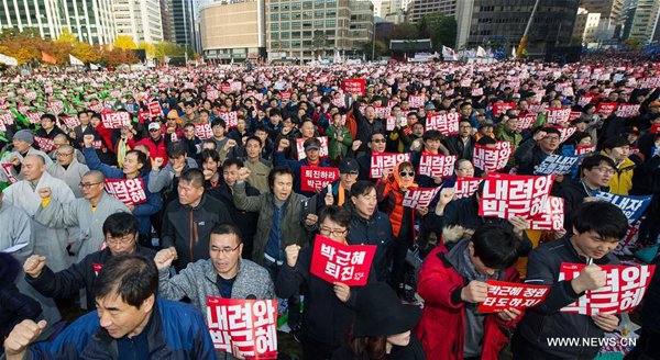People attend a rally in downtown Seoul, capital of South Korea, Nov. 12, 2016. South Koreans staged peaceful rallies across central Seoul on Saturday night to demand President Park Geun-hye step down over a scandal involving her longtime confidante and former aides. (Xinhua) People attend a rally in downtown Seoul, capital of South Korea, Nov. 12, 2016. South Koreans staged peaceful rallies across central Seoul on Saturday night to demand President Park Geun-hye step down over a scandal involving her longtime confidante and former aides. (Xinhua)