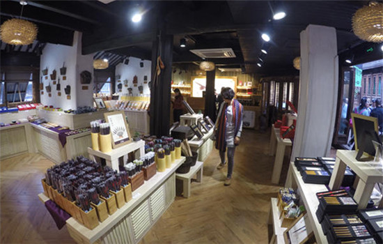 The chopsticks shop in Wuzhen displays a wall of chopsticks and paintings of the whole chopstick-making process and Chinese dining customs. The chopsticks shop in Wuzhen displays a wall of chopsticks and paintings of the whole chopstick-making process and Chinese dining customs.