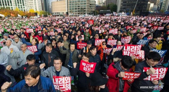 People attend a rally in downtown Seoul, capital of South Korea, Nov. 12, 2016. South Koreans staged peaceful rallies across central Seoul on Saturday night to demand President Park Geun-hye step down over a scandal involving her longtime confidante and former aides. (Photo/Xinhua) People attend a rally in downtown Seoul, capital of South Korea, Nov. 12, 2016. South Koreans staged peaceful rallies across central Seoul on Saturday night to demand President Park Geun-hye step down over a scandal involving her longtime confidante and former aides. (Photo/Xinhua)