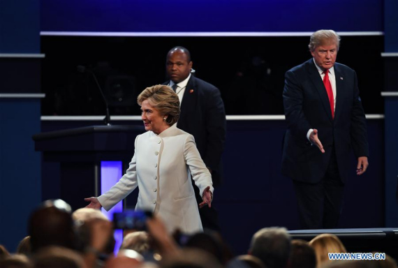 Republican presidential candidate Donald Trump (R) and Democratic presidential candidate Hillary Clinton (front) participate in the third and final presidential debate at the University of Nevada Las Vegas (UNLV) in Las Vegas, Nevada, the United States, Oct. 19, 2016.(Photo: Xinhua/Yin Bogu) Republican presidential candidate Donald Trump (R) and Democratic presidential candidate Hillary Clinton (front) participate in the third and final presidential debate at the University of Nevada Las Vegas (UNLV) in Las Vegas, Nevada, the United States, Oct. 19, 2016.(Photo: Xinhua/Yin Bogu)