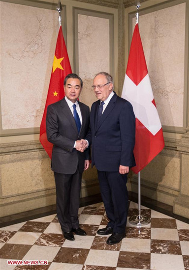 Chinese Foreign Minister Wang Yi (L) shakes hands with Swiss President Johann Schneider-Ammann in Bern, Switzerland, on Dec. 12, 2016. (Xinhua/Xu Jinquan) Chinese Foreign Minister Wang Yi (L) shakes hands with Swiss President Johann Schneider-Ammann in Bern, Switzerland, on Dec. 12, 2016. (Xinhua/Xu Jinquan)