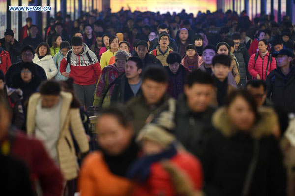 Arriving passengers exit the Beijing Railway Station in Beijing, capital of China, Feb. 12, 2016. (Photo: Xinhua/Ju Huanzong) Arriving passengers exit the Beijing Railway Station in Beijing, capital of China, Feb. 12, 2016. (Photo: Xinhua/Ju Huanzong)