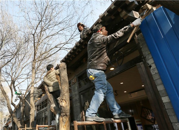 Restoration work is underway in Beijing's Nanluoguxiang earlier this month. (Photo by Sun Yue/For China Daily) Restoration work is underway in Beijing's Nanluoguxiang earlier this month. (Photo by Sun Yue/For China Daily)