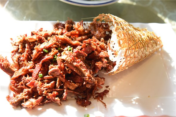 Shredded roast rabbit meat (Photo by Zhang Xingjian/chinadaily.com.cn) Shredded roast rabbit meat (Photo by Zhang Xingjian/chinadaily.com.cn)