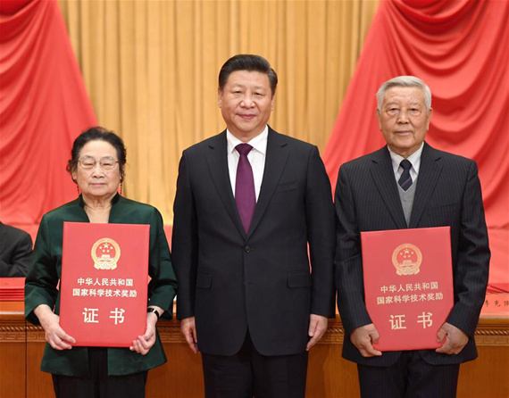 Chinese President Xi Jinping (C) presents award certificates to physicist Zhao Zhongxian (R) and pharmacologist Tu Youyou, who won China's top science award, at an annual ceremony held to honor distinguished scientists and research achievements in Beijing, capital of China, Jan. 9, 2017. (Xinhua/Li Xueren) Chinese President Xi Jinping (C) presents award certificates to physicist Zhao Zhongxian (R) and pharmacologist Tu Youyou, who won China's top science award, at an annual ceremony held to honor distinguished scientists and research achievements in Beijing, capital of China, Jan. 9, 2017. (Xinhua/Li Xueren)