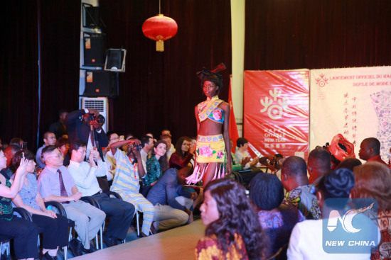 Photo shows a model wearing clothes with strong Chinese flavor during a fashion show that kickstarted Benin's 2-week long celebrations of Chinese Lunar New Year of 2017, the year of the Rooster. (Xinhua) Photo shows a model wearing clothes with strong Chinese flavor during a fashion show that kickstarted Benin's 2-week long celebrations of Chinese Lunar New Year of 2017, the year of the Rooster. (Xinhua)